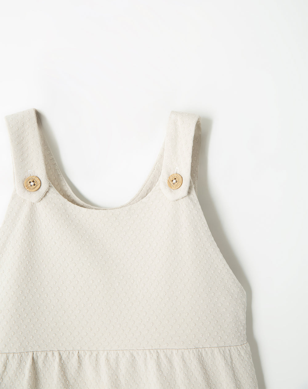 Vestido corto texturizado crudo niña