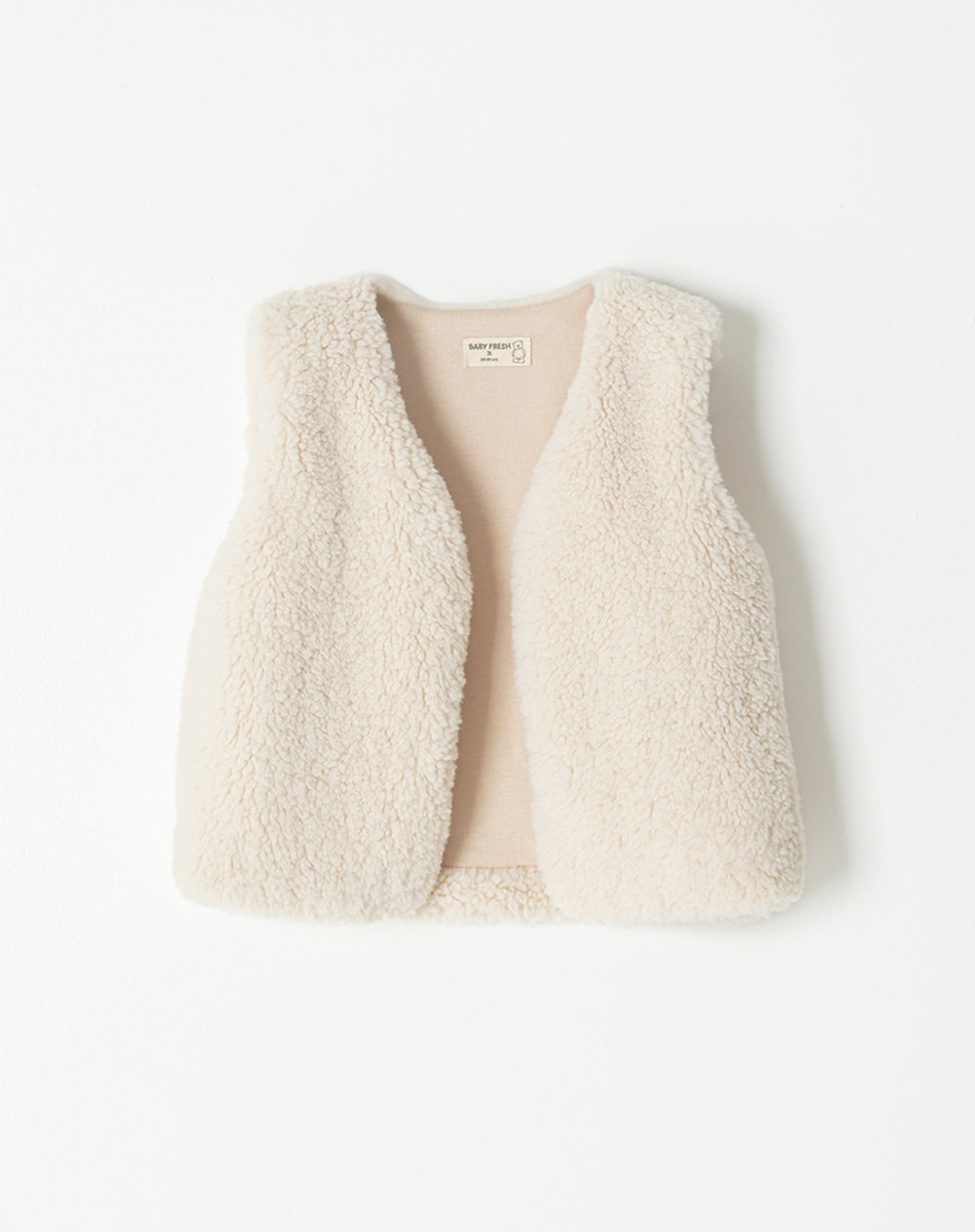 Chaleco regular peludo crema niña