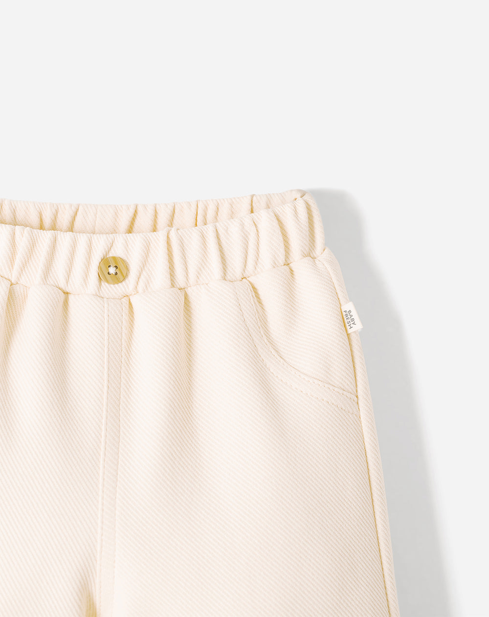 Pantalón straight crema bebé unisex