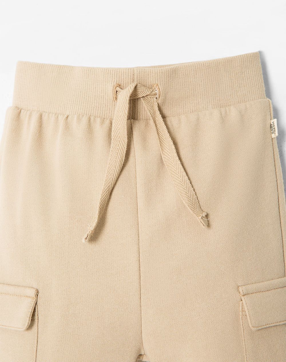 Jogger regular algodón beige niño