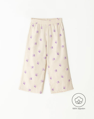 Pantalón loose fit tiro alto crema estampado